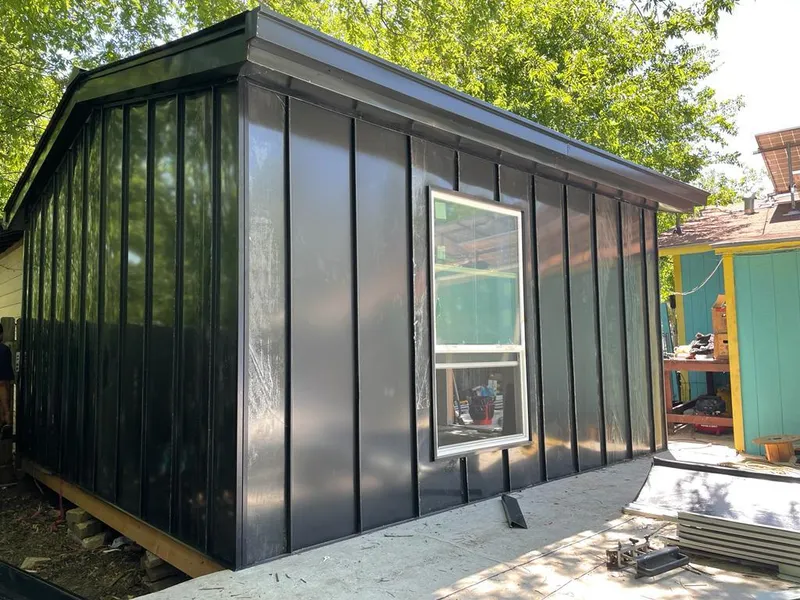 Black standing seam metal wall panels for Roof Inspection in Woodland Park